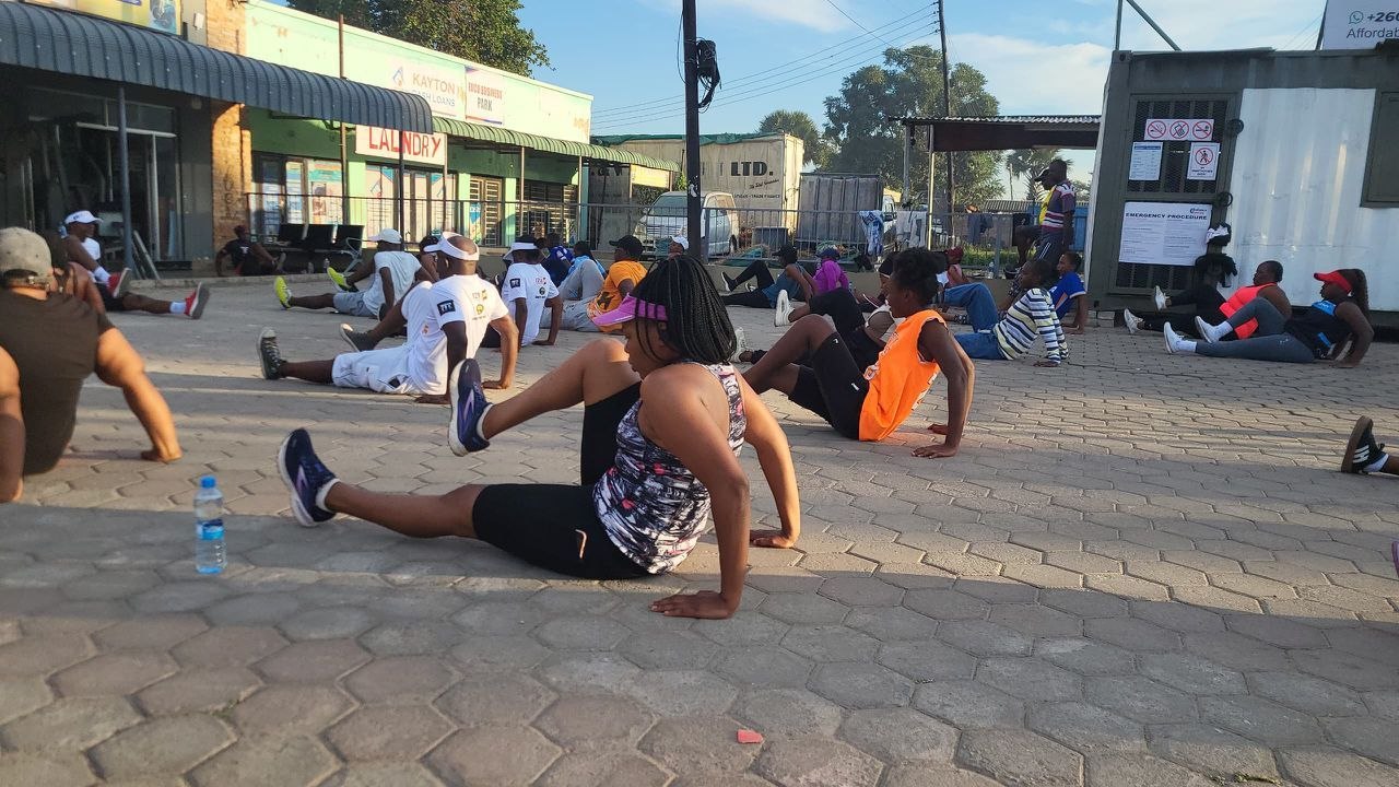 Participants stretching during morning aerobics session